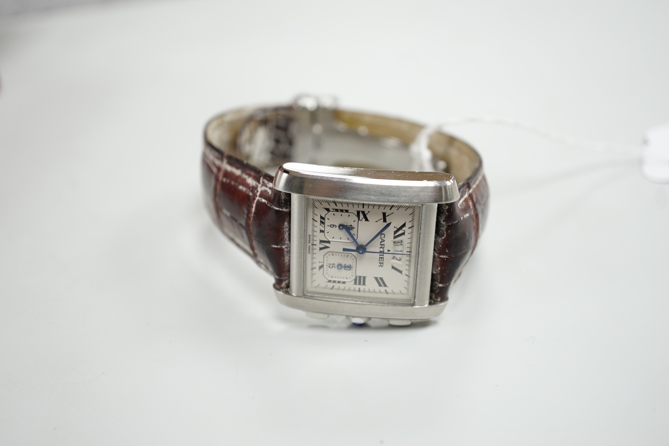 A gentleman's 2006 stainless steel Cartier Tank Francaise quartz wrist watch, with Roman numerals and two subsidiary dials, case diameter 30mm, with original Cartier box and booklets.